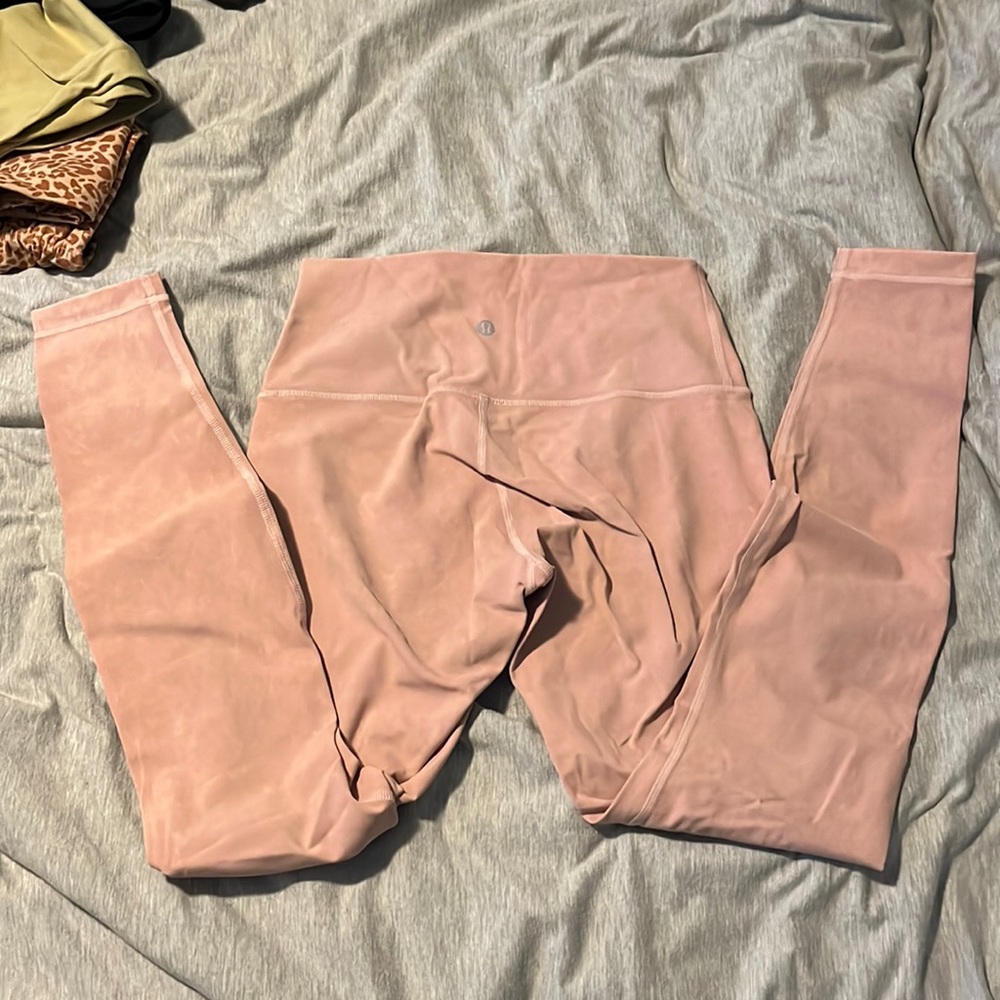 Lululemon leggings.  Rare pastel pink. High rise. Size 6. Perfect condition